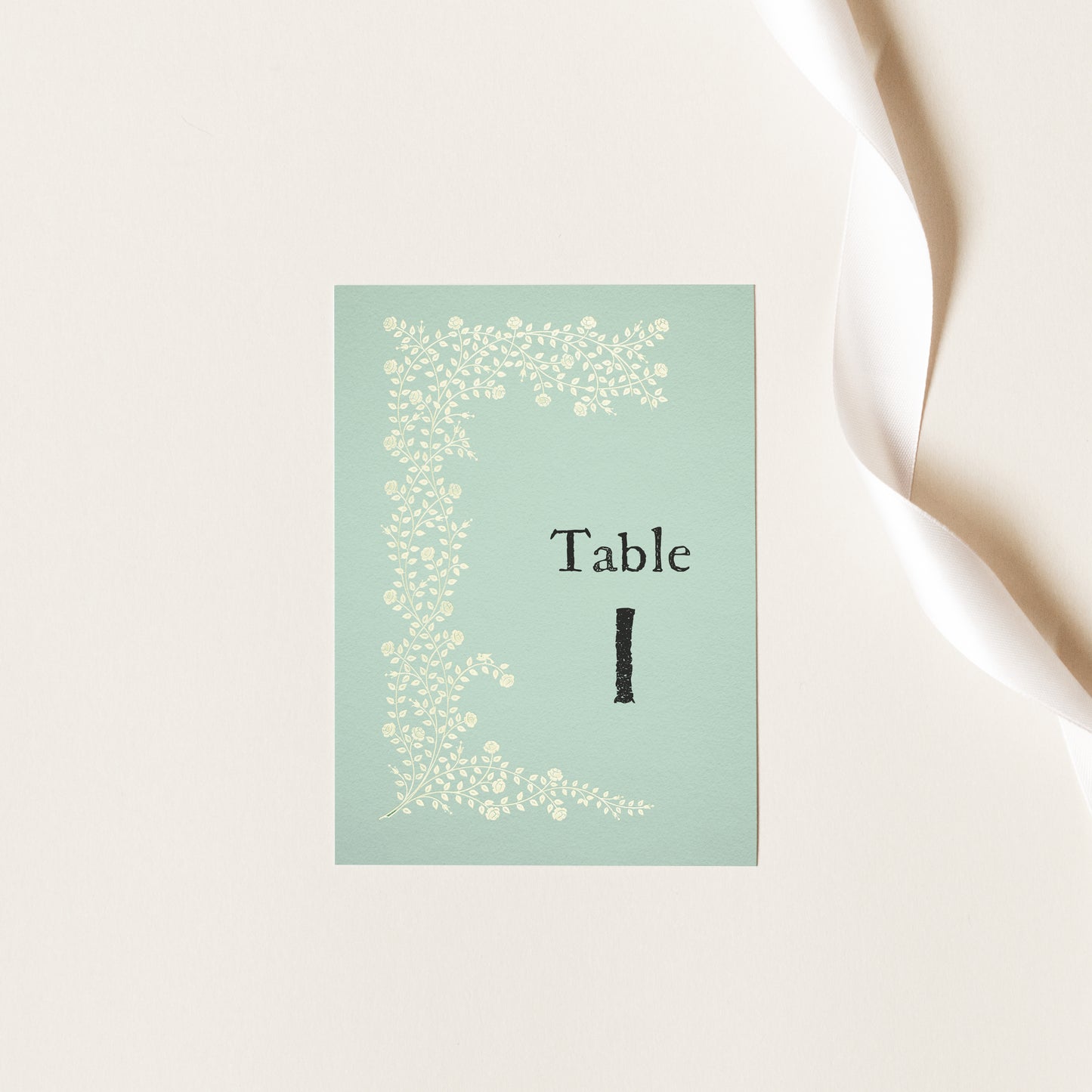 Whimsical table numbers in sage green for garden wedding or party